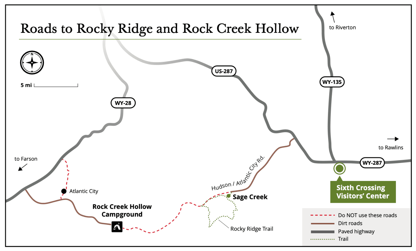 Map of roads to Rocky Ridge and Rock Creek Hollow: US-287 and WY-28 paved highways, dirt roads to Rock Creek Hollow Campground and Sage Creek, roads through Atlantic City marked do-not-use, Sixth Crossing Visitors' Center marked at the WY-287/WY-135 junction