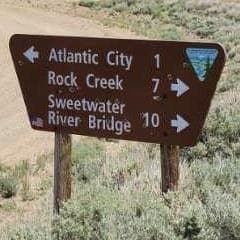 Brown BLM sign: Atlantic City 1, Rock Creek 7, Sweetwater River Bridge 10